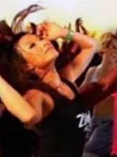 A dancer mid-move with hair flying, from Alchemy’s Zumba poster.