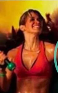 A smiling woman mid-workout with a hand weight, from Alchemy’s Zumba poster.