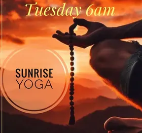 Alchemy’s Sunrise Yoga poster: a hand holding prayer beads against an orange sunrise.