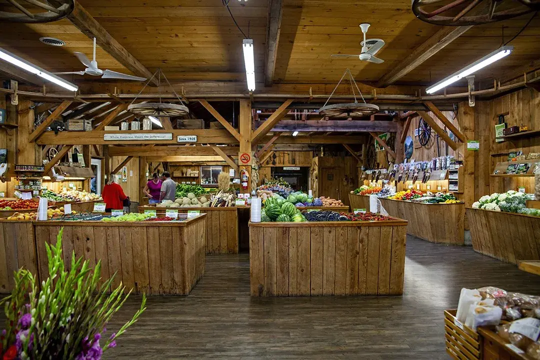 Inside the market, under the timber beams
