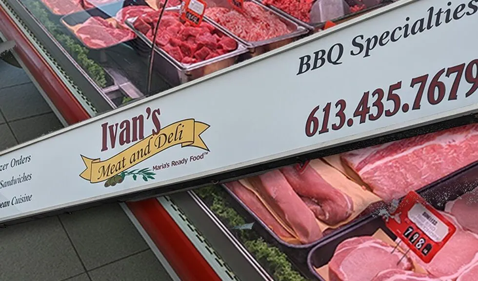 Ivan’s meat counter, with the shop’s sign above trays of fresh cuts